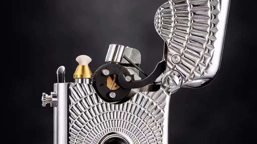 alt="Close-up view of the Eye of Diamond Single-Claw mechanical lighter showing the exposed ignition mechanism and engraved metal surface"