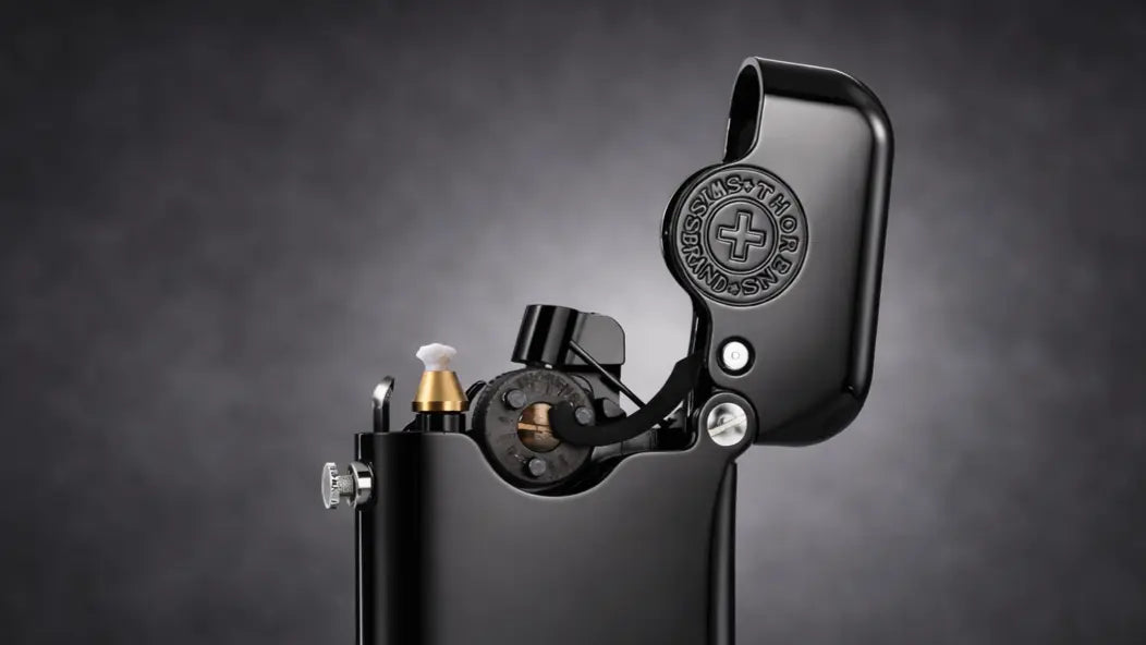 Gen-1 Single Claw mechanical lighter with side-mounted refueling port, glossy black finish, close-up detail view