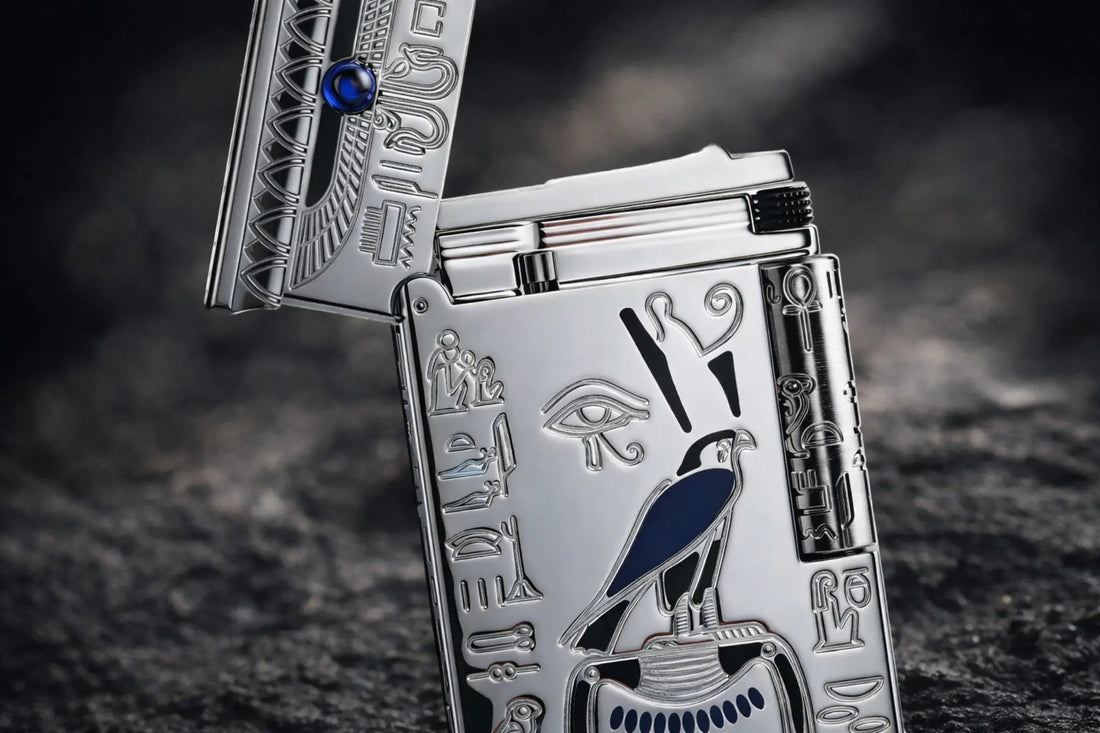 Pharaoh lighter with ancient Egyptian engraving, Eye of Horus motif, silver metal body, and side-roller fluid lighter ignition