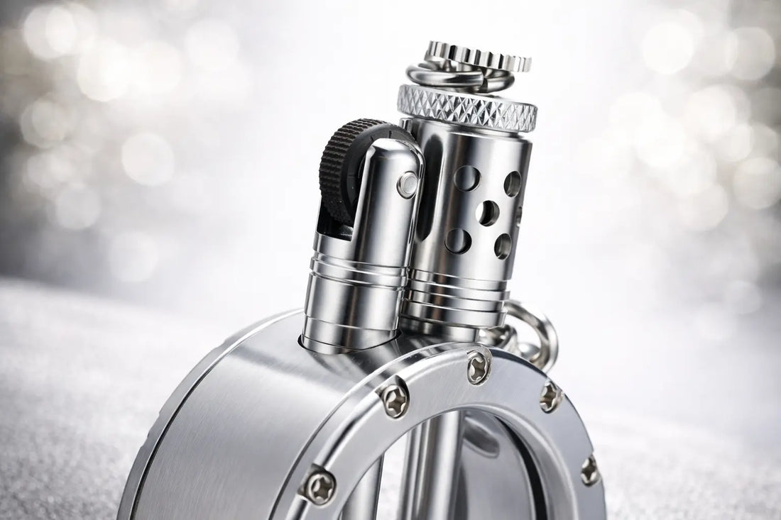 Round pocket watch lighter with silver metal body and visible mechanical details