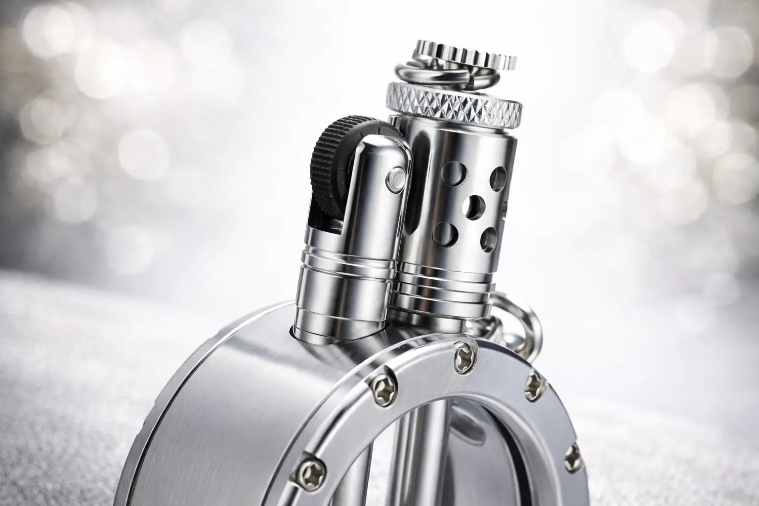 Round pocket watch lighter with silver metal body and visible mechanical details