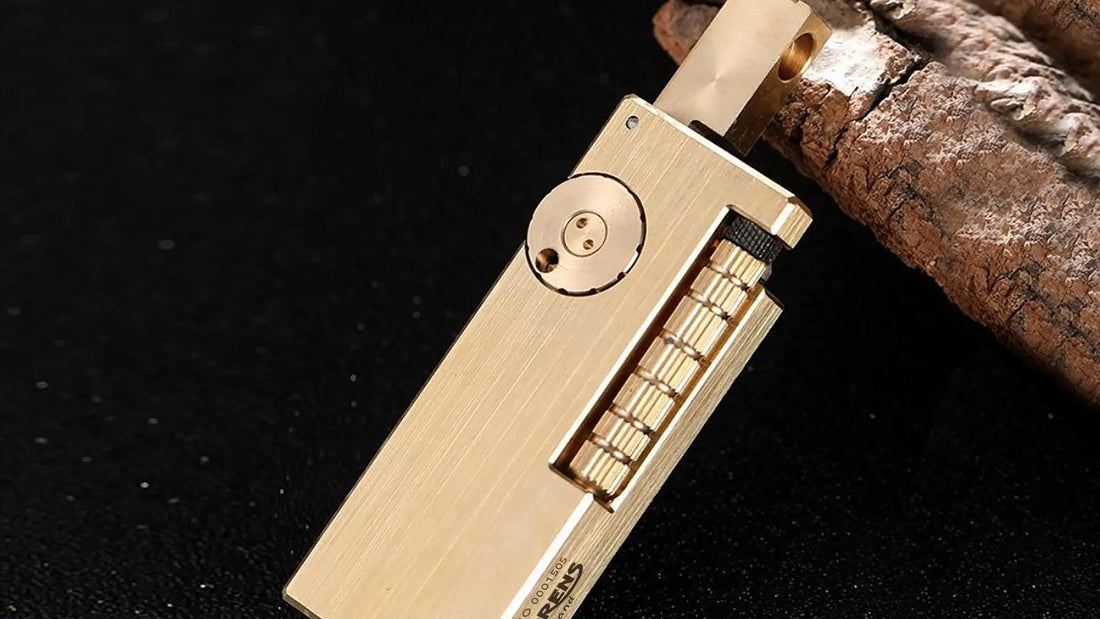 Side slip brass lighter with narrow rectangular body, dual fuel reservoirs, and precision side ignition design by THORENS