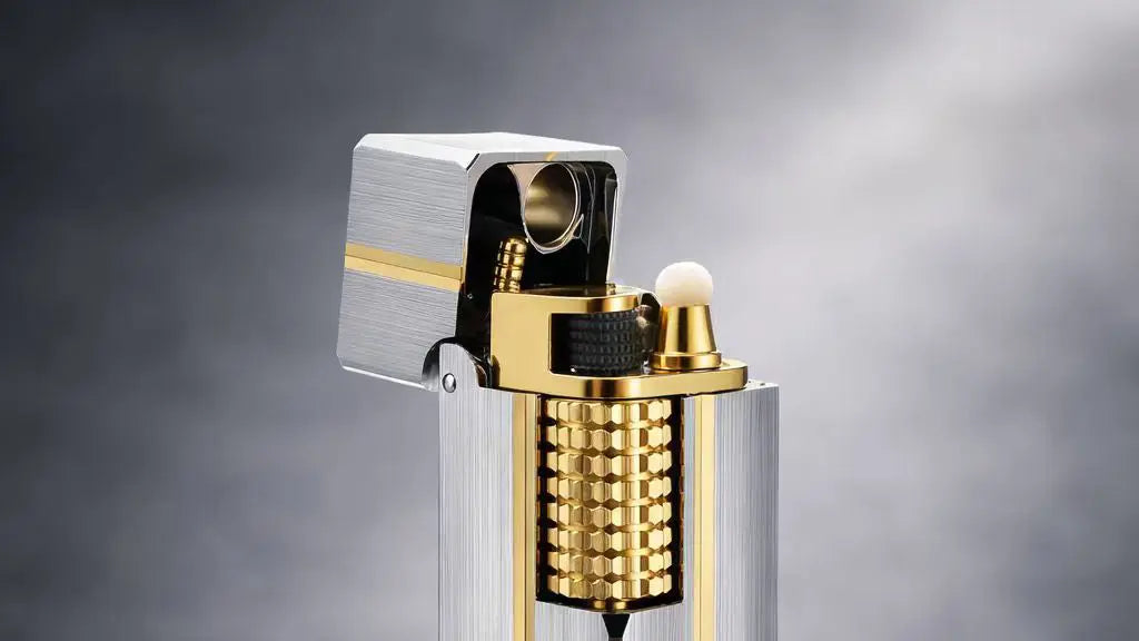 Side slip rectangular lighter with brushed silver body and gold upper detail, shown in close-up