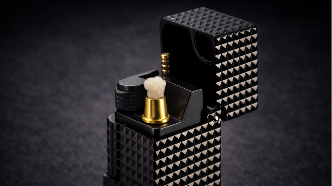 Close-up detail of a side slip rectangular fluid lighter with small-square pyramid texture and precision ignition mechanism