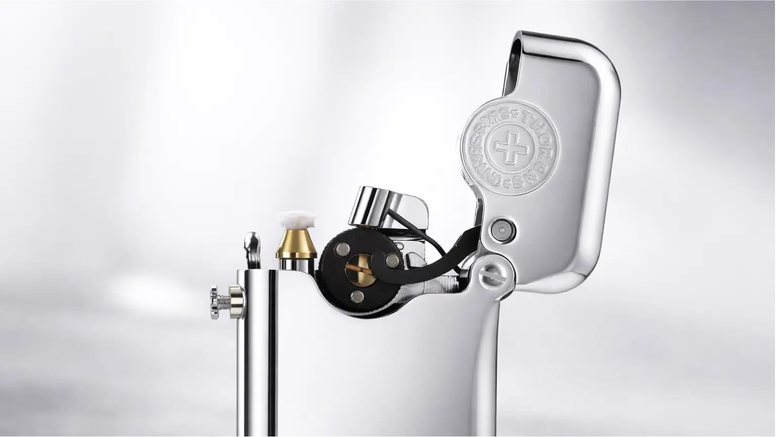 Mechanical detail of a single claw bottom-fill fluid lighter showing solid brass construction