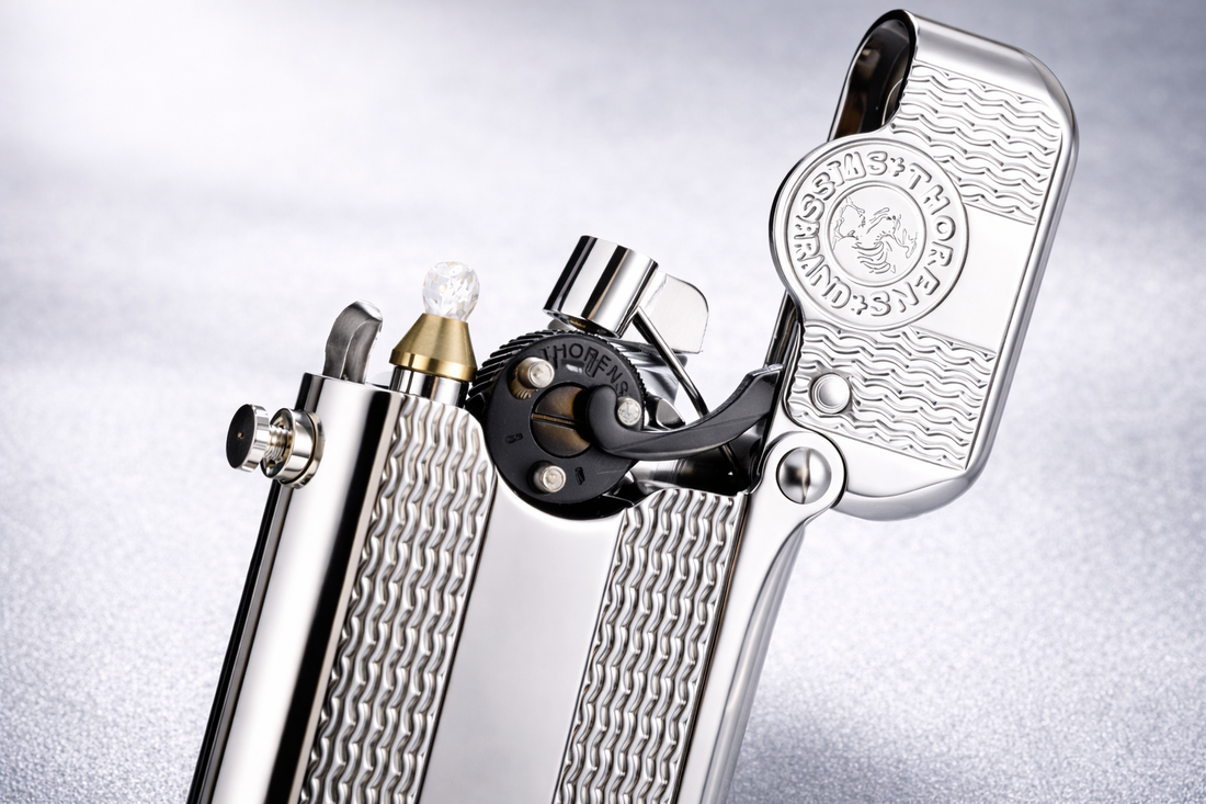 Single claw lighter with polished silver finish and wave-pattern engraving by THORENS