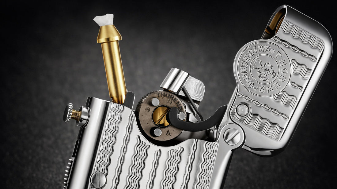 TELEFLAM single claw fluid lighter with exposed mechanical ignition and water ripple engraved silver body