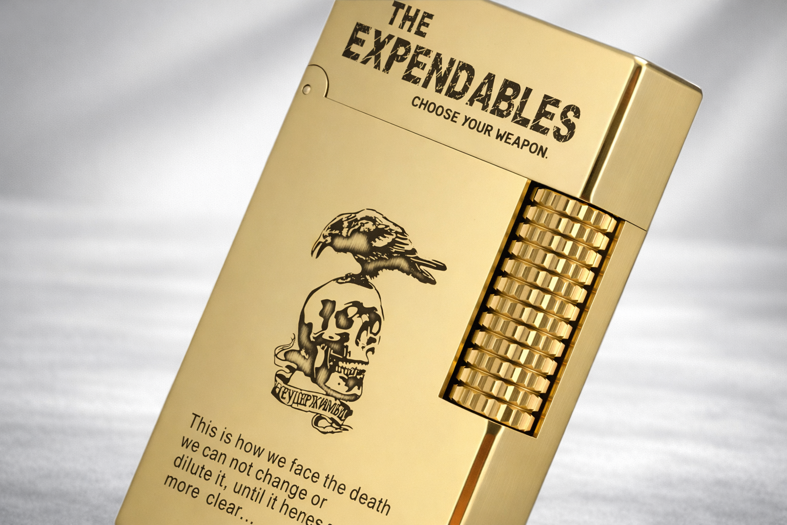 The Expendables lighter with side-slip roller ignition, bold engraved typography, and raptor and skull motif