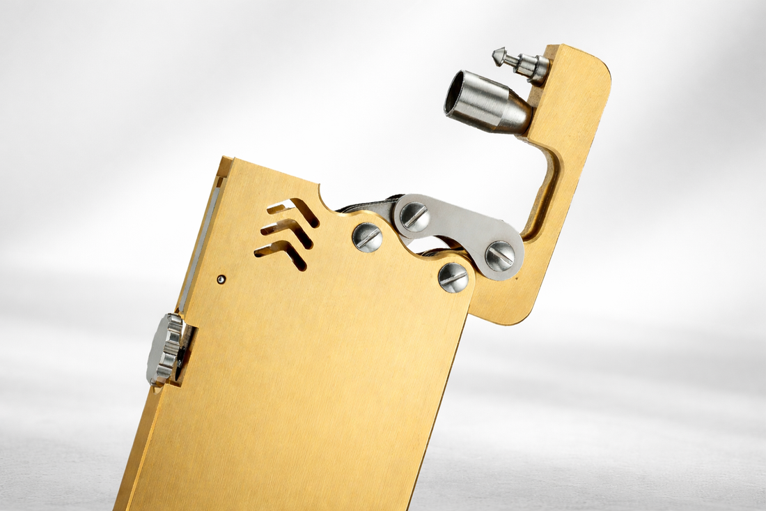 Thin ejection lighter showcasing mechanical design and brushed brass finish