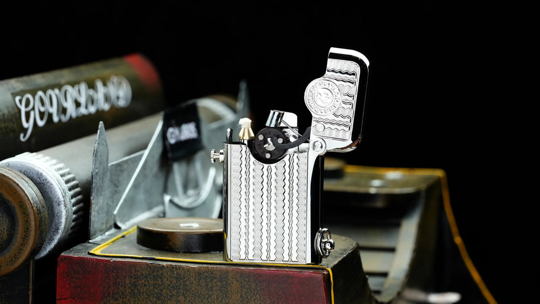 THORENS silver Single-Claw luxury fluid lighter open with exposed mechanical detail on a workshop-style surface