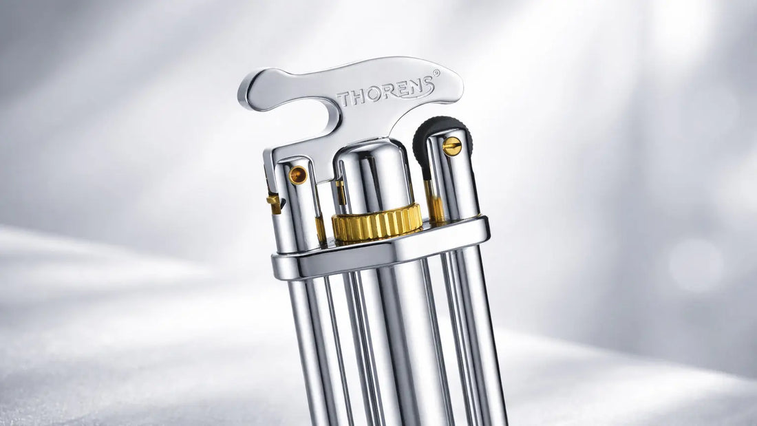 Thorens three-section stick lighter showing refillable fluid lighter mechanism and mechanical structure