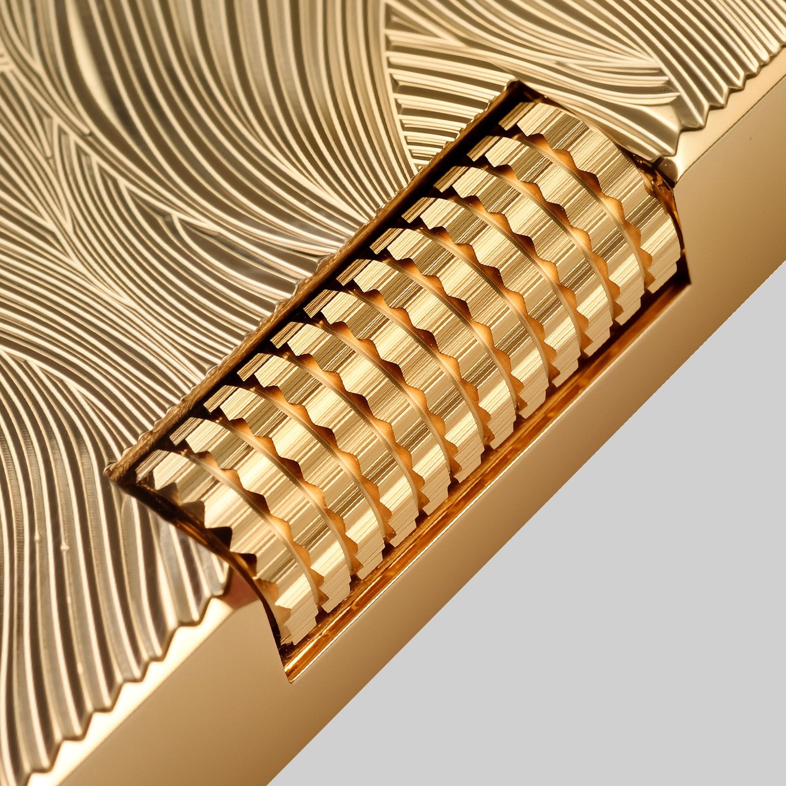 THORENS Aqua Rhythm - Gold lighter featuring a precision-engineered knurled roller and CNC-machined wave patterns for tactile resistance.
