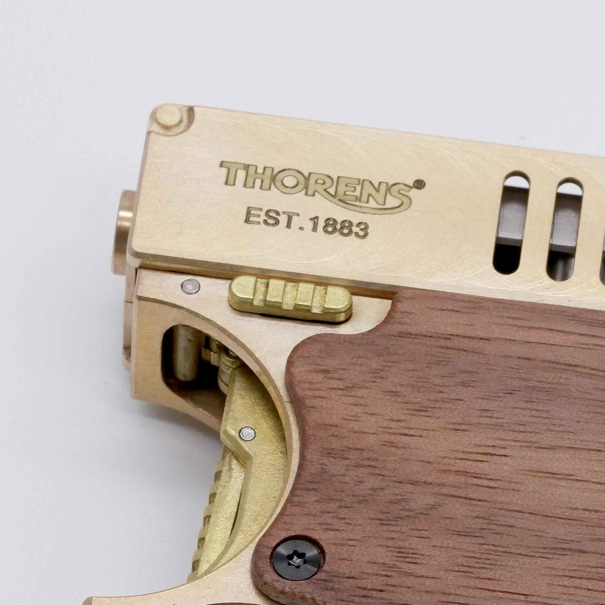 THORENS Marksman (Gun Lighter II) in solid brass with a wood grip, featuring precision-engineered mechanical linkages and heritage engravin…