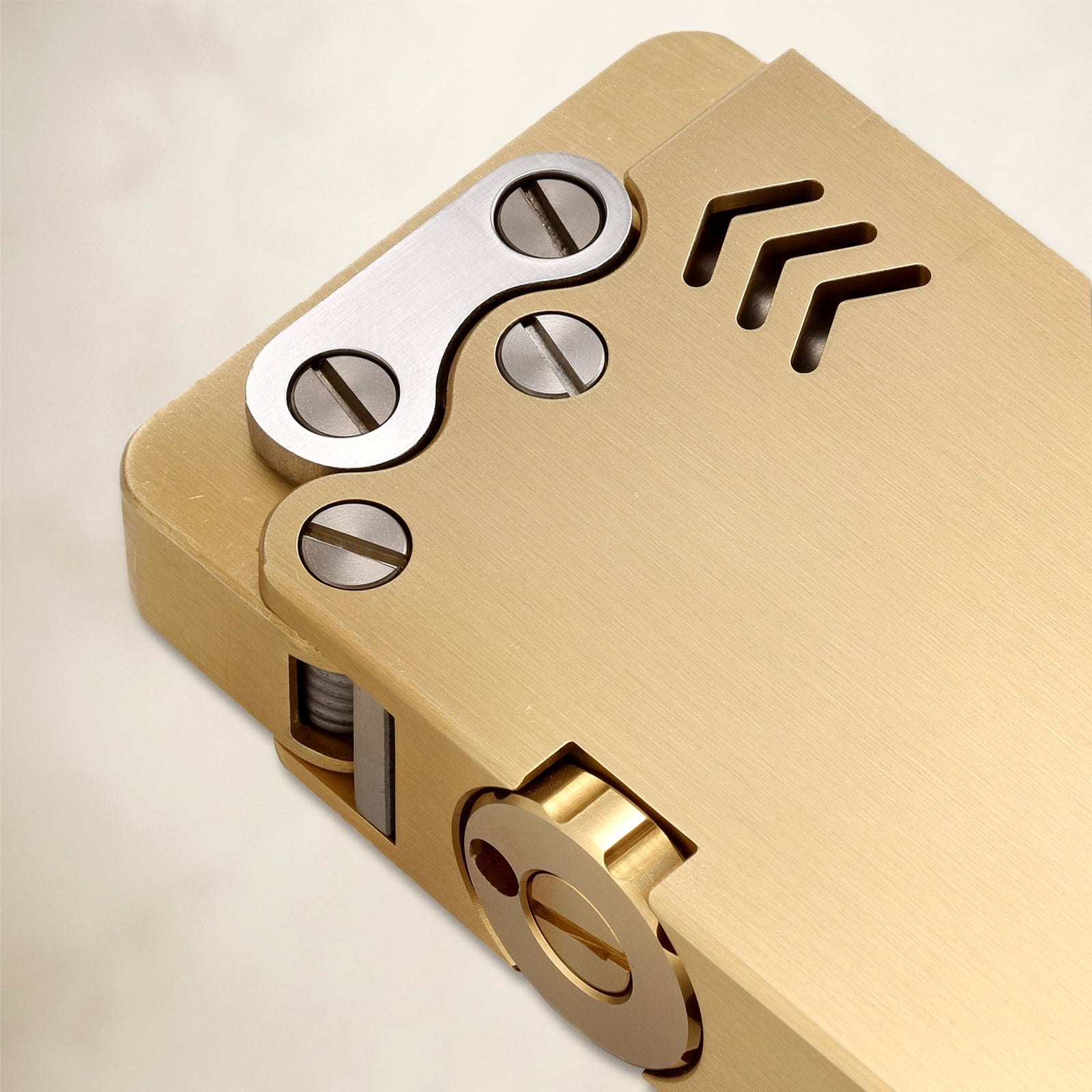 THORENS Ejection Lighter - Brass Finish featuring precision-engineered mechanical linkages, exposed screws, and a brushed brass body.