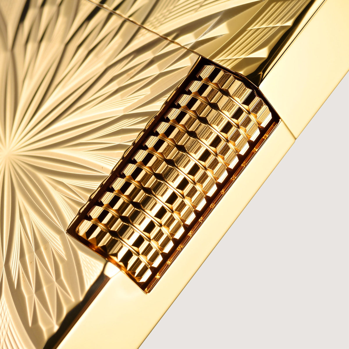 THORENS Blooming Radiance - Gold lighter featuring a precision-engineered tactile roller and sunburst CNC-machined floral patterns.