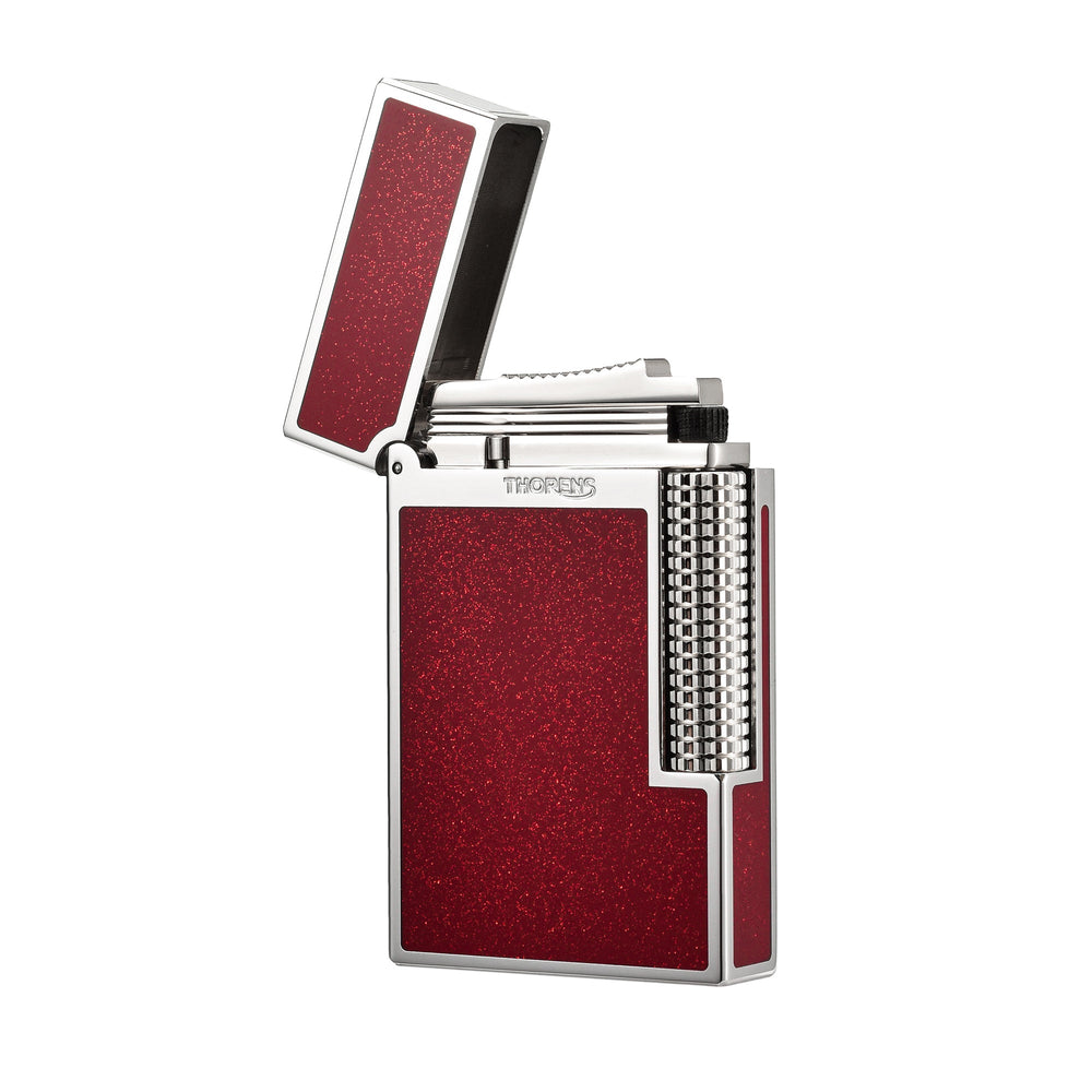 Thorens Scarlet Stardust lighter featuring a precision-engineered chrome body with red glitter inlays and a textured roller ignition.