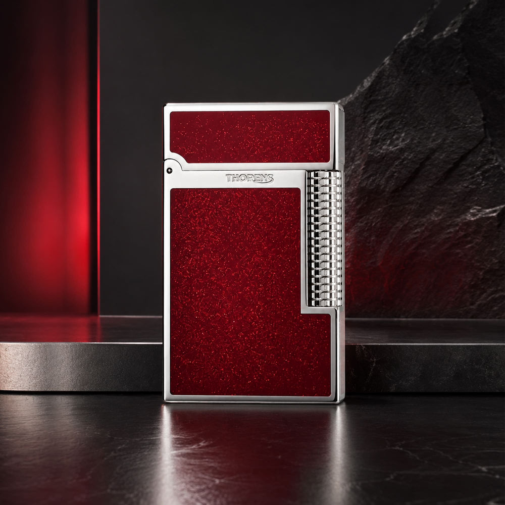 Thorens Scarlet Stardust fluid lighter featuring a precision-engineered chrome frame and shimmering red lacquer finish.