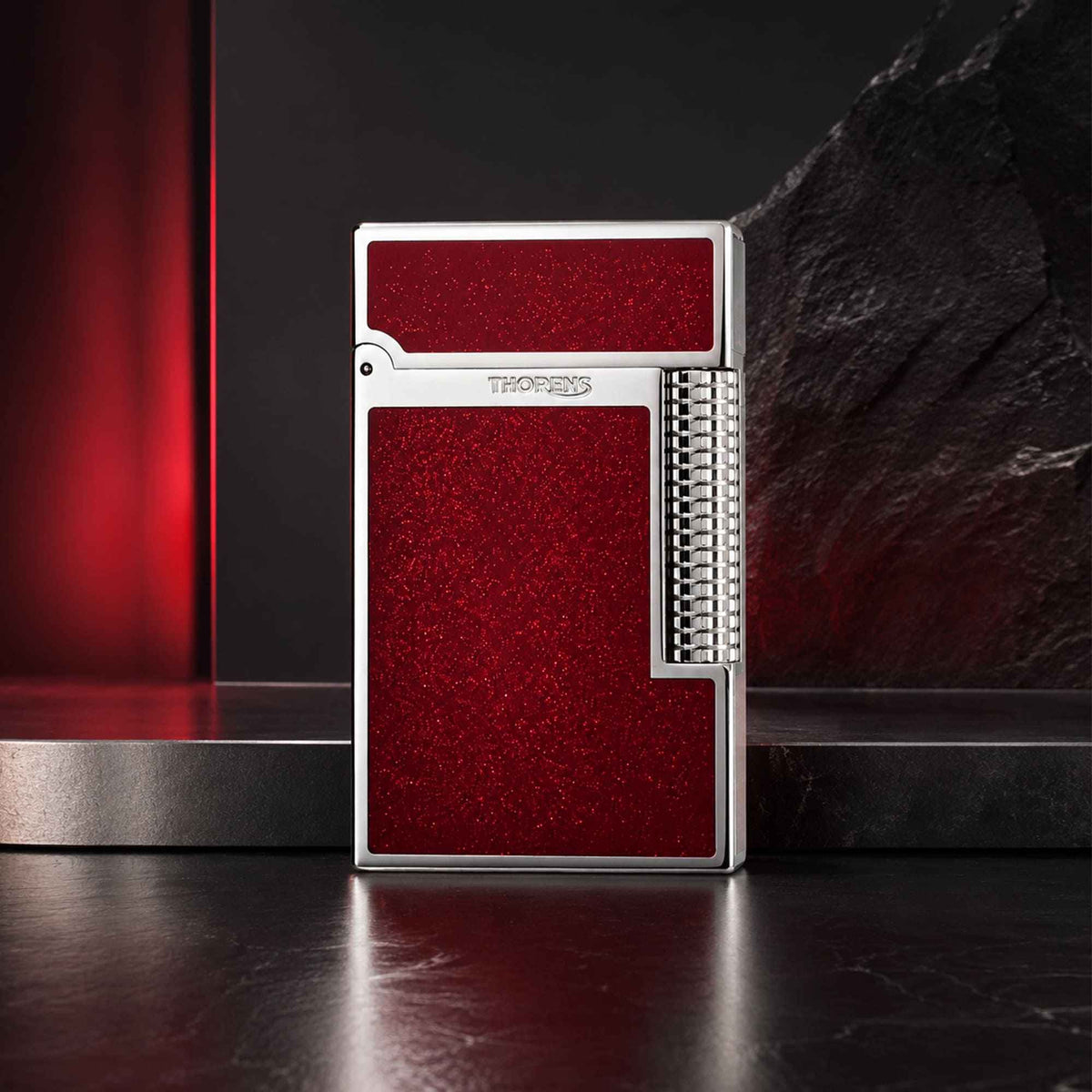 Thorens Scarlet Stardust fluid lighter featuring a precision-engineered chrome frame and shimmering red lacquer finish.