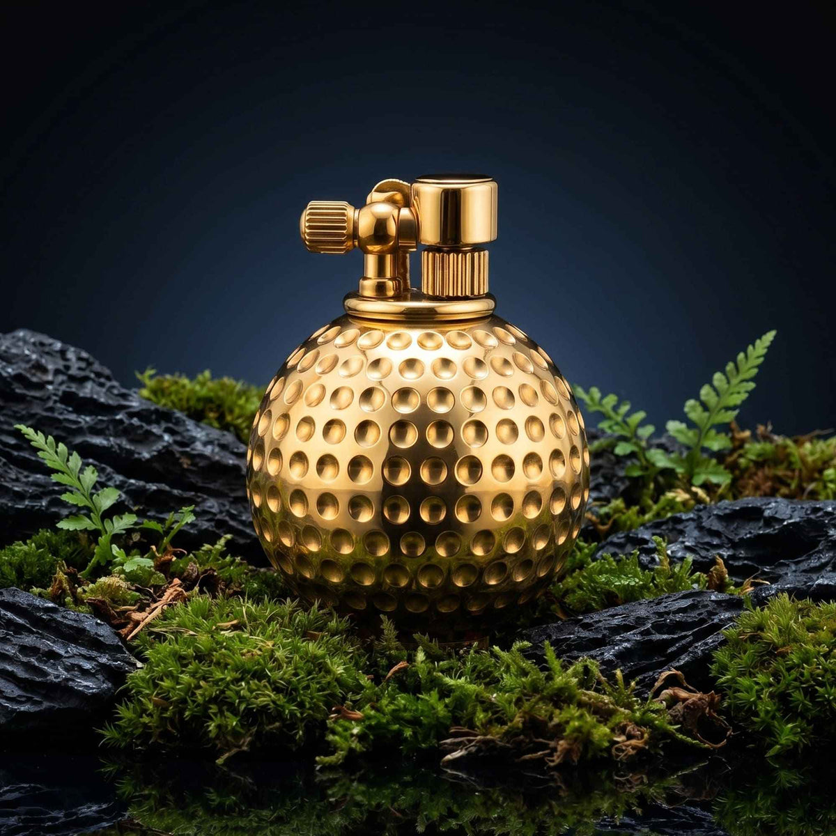 Dimpled Ace mechanical fluid lighter in solid brass with a golf ball texture and precision-engineered ignition assembly.