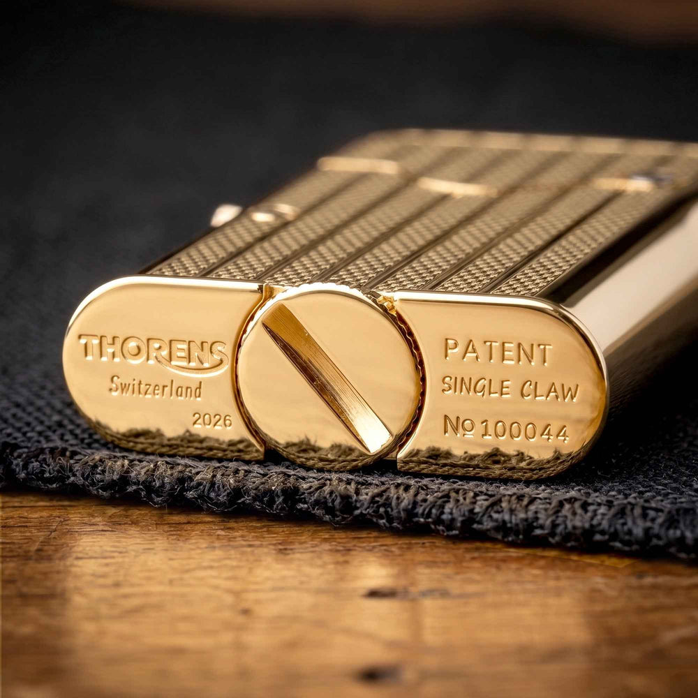 THORENS Gen 7 - Single Claw - TELEFLAM - Fluted Gold lighter base showing precision-engineered Swiss engravings and a tactile fuel screw.