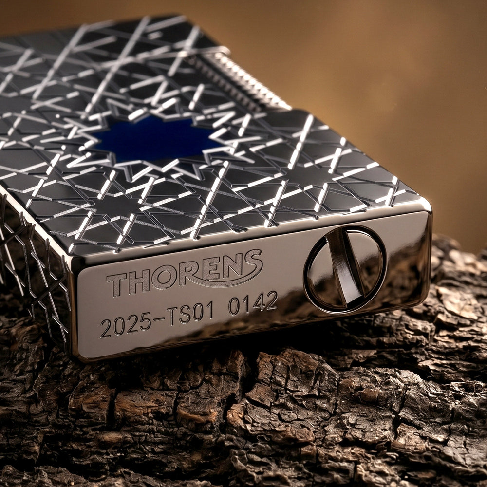 Detailed views of the Thorens Stellar Mesh Black lighter showcasing the textured flint wheel, engraved bottom hallmark, and blue mesh star inlay.