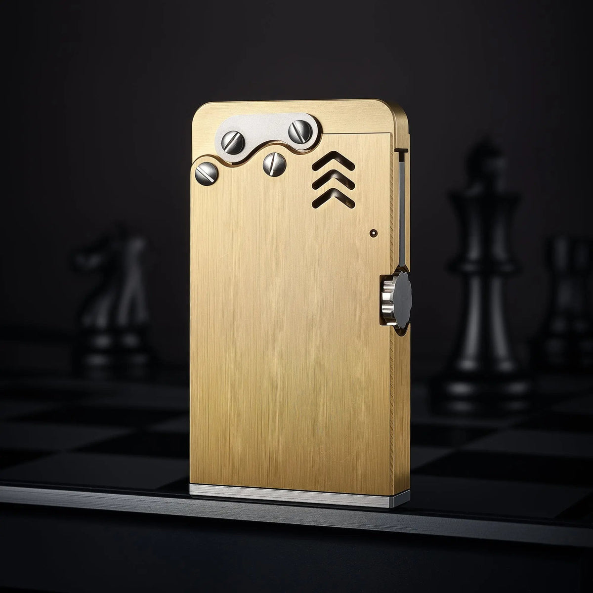Slim Thorens ejection lighter standing upright, showcasing the brushed brass texture, mechanical silver-tone bolts, and side ignition wheel.