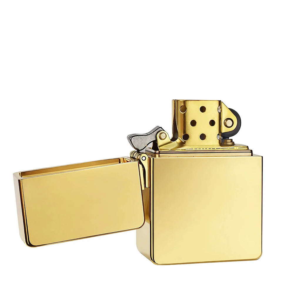 A detailed view of the gold Armor lighter's interior, showcasing the high-polish gold insert, the classic cam lever mechanism, and the thick-walled solid brass case construction that defines the Armor series.