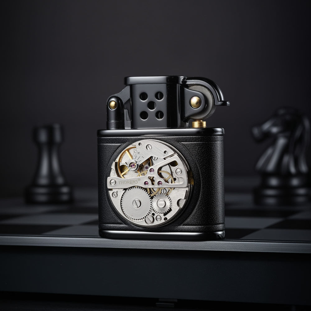 Front view of the hand-stitched black leather lighter with inlaid mechanical movement, displayed on a dark chessboard-style background.