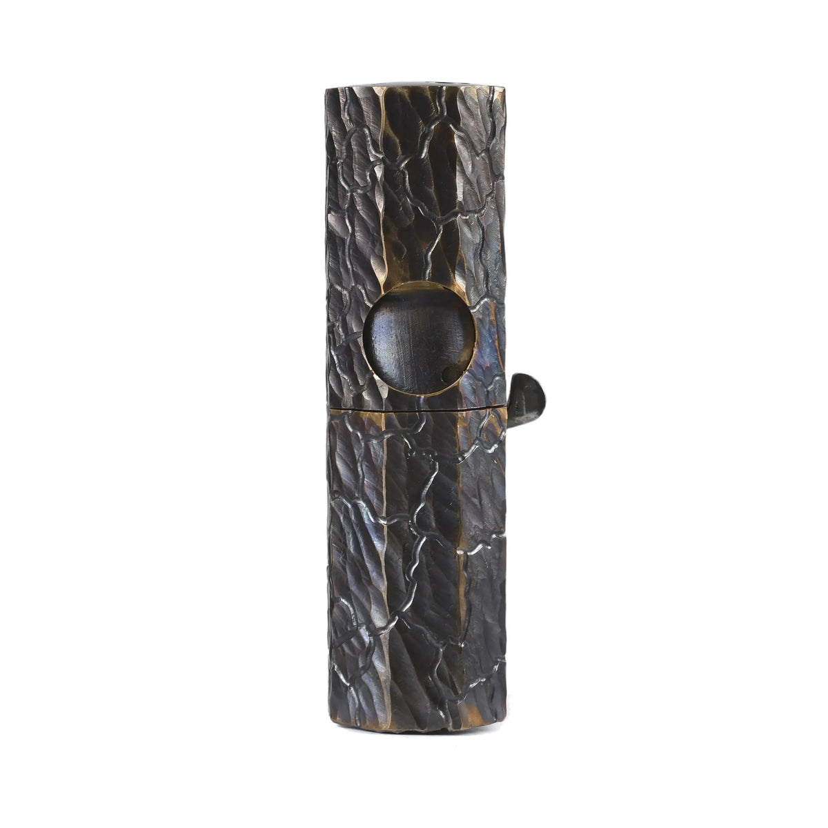 A sleek Octagon Trigger mechanical lighter featuring a glossy black hand-carved texture and antique brass accents, showcasing refined EDC aesthetics and heritage craftsmanship.