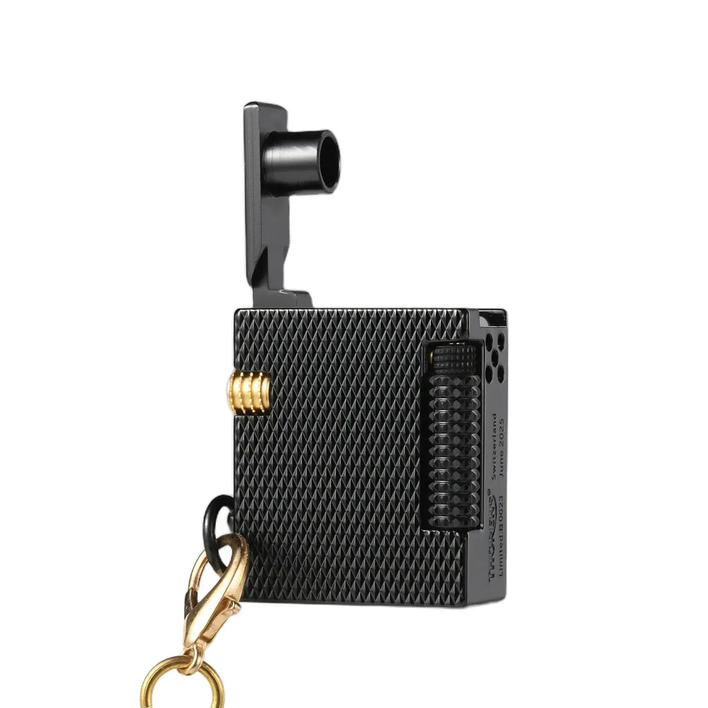 Thorens Mini Cube Black Mesh lighter shown open on a white background, featuring a compact square form, textured black mesh finish, side flint wheel, gold-tone accent, and attached clasp hardware