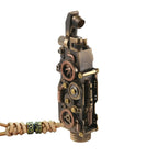 Thorens steampunk mechanical grip lighter in antique bronze shown open on a white background, featuring exposed fine gears, layered mechanical detailing, and a leather lanyard with bead accents
