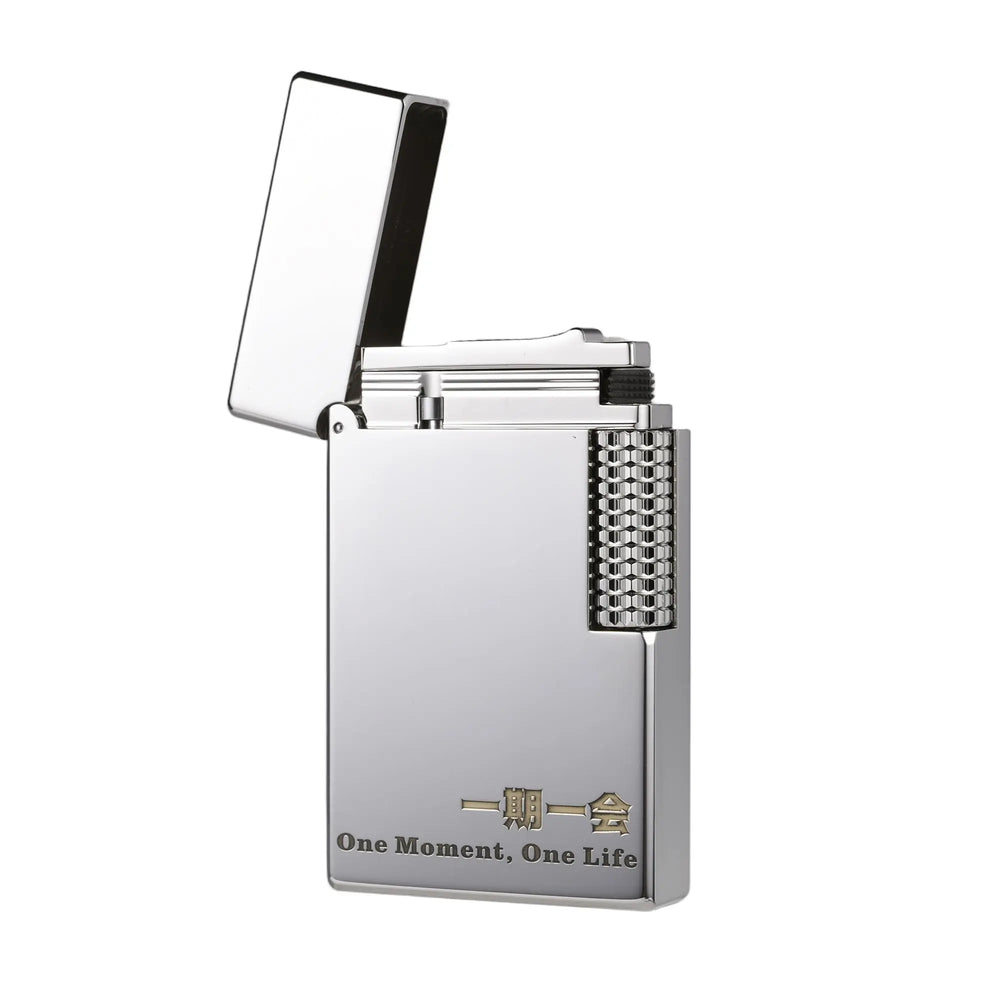 A precision-engineered silver Thorens lighter in an open position, showcasing its mechanical flint wheel and polished chrome finish with an engraved "One Moment, One Life" philosophy.