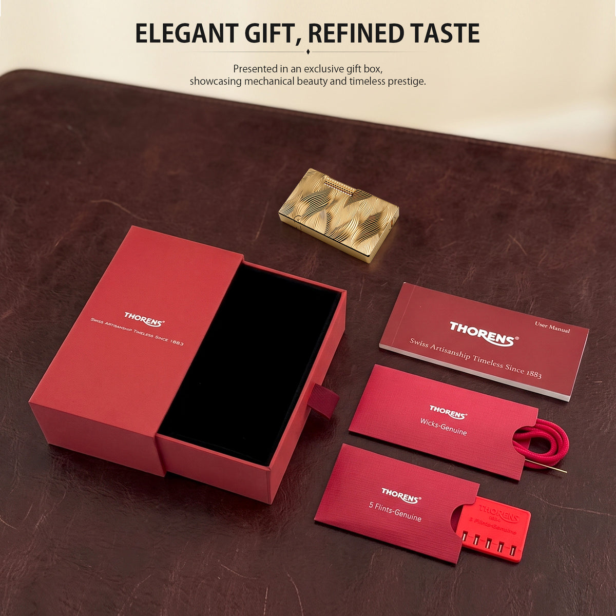 A gold Thorens Aqua Rhythm lighter resting on a rich mahogany surface. The design features a continuous, flowing wave pattern engraved across the entire face, with a prominent knurled side-roller.