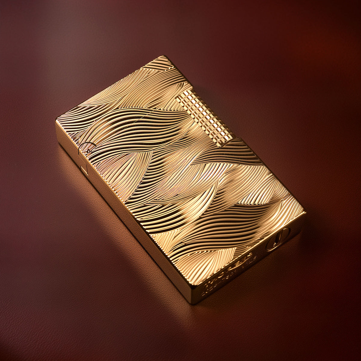 A close-up perspective of the gold Thorens Aqua Rhythm lighter lying on its side, highlighting the deep-etched wave patterns and the branded base featuring the Thorens logo, the "2024-TS01" serial series, and the fuel port.