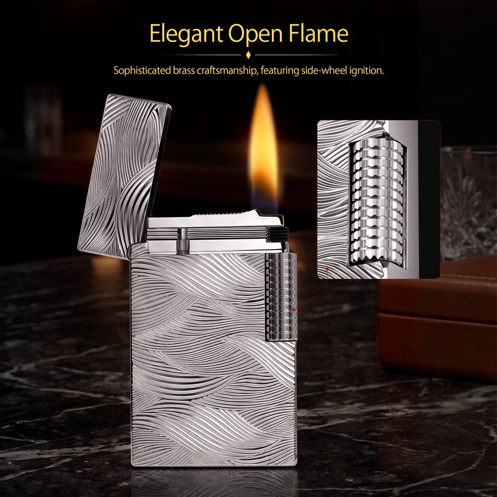 A detailed view of the ignited Thorens Aqua Rhythm silver lighter with an open lid, showcasing the striking sparks, active flame, and intricate wave-like textured pattern.