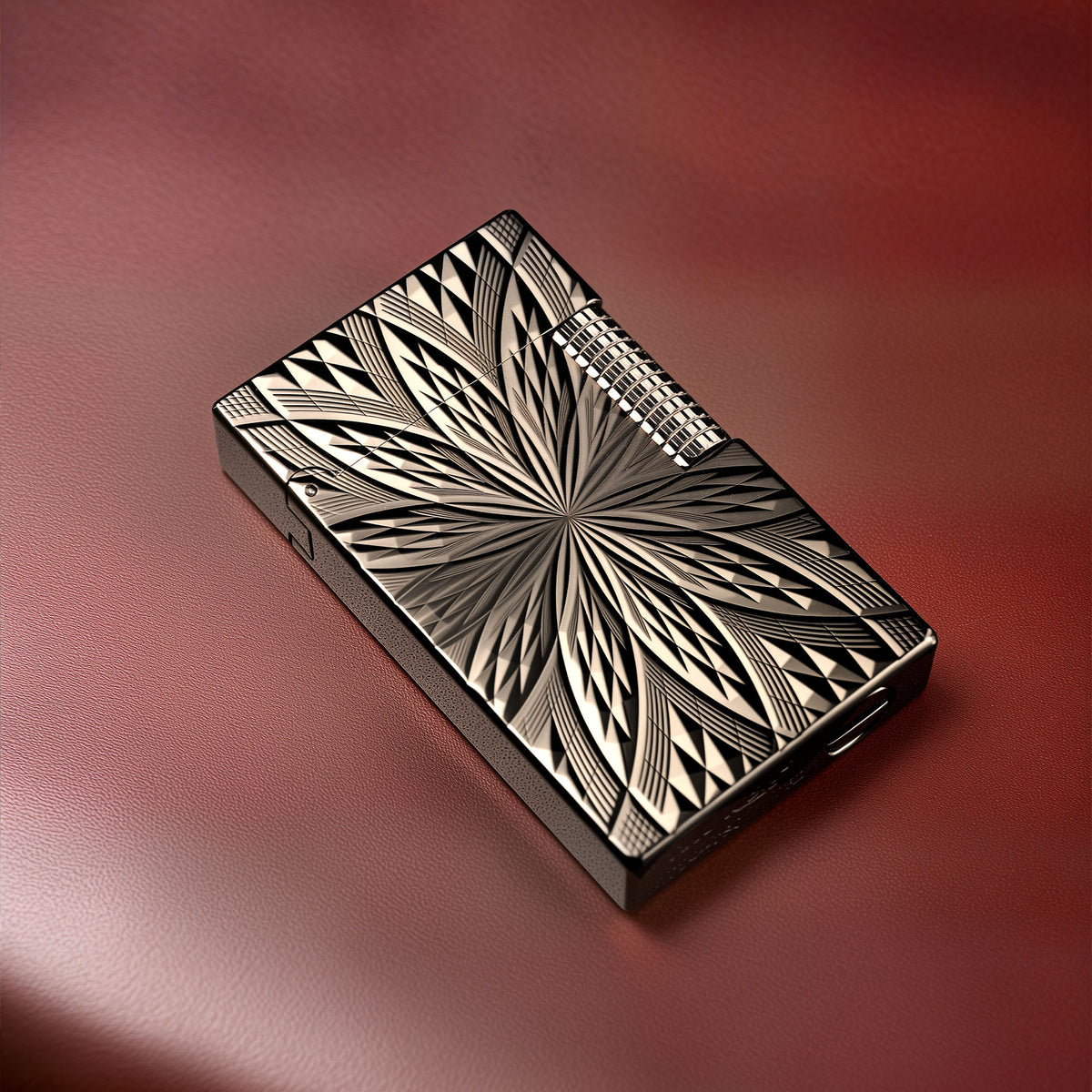 A Thorens Blooming Radiance black lighter with a geometric floral engraving, resting on a red leather surface to highlight its mechanical precision and brass craftsmanship.