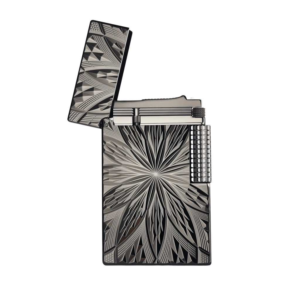 A high-angle shot of the Blooming Radiance black lighter with the lid open, highlighting the internal mechanism and the deep, geometric floral engravings on the brass body.