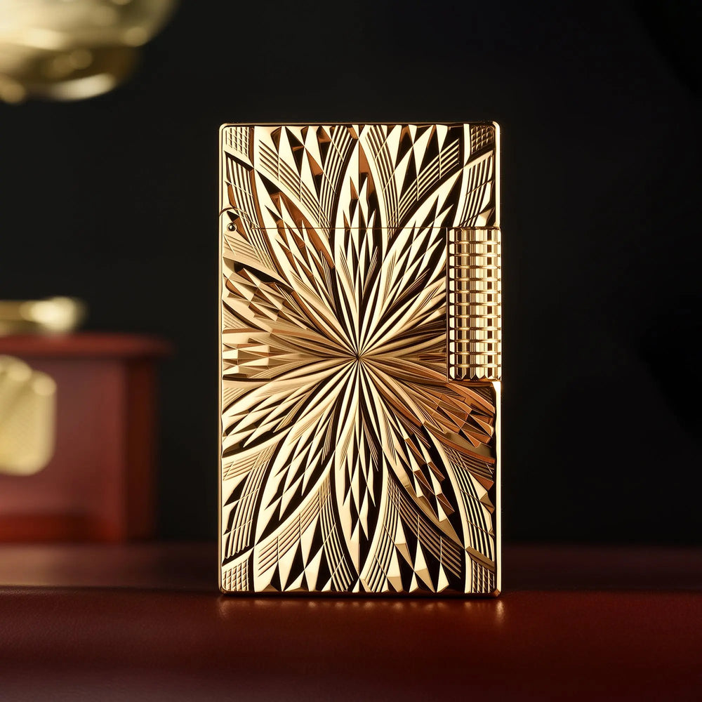 A front-facing showcase of the Thorens Blooming Radiance gold lighter, featuring a brilliant 18k gold-plated finish with intricate symmetrical floral engravings and a textured side roller.