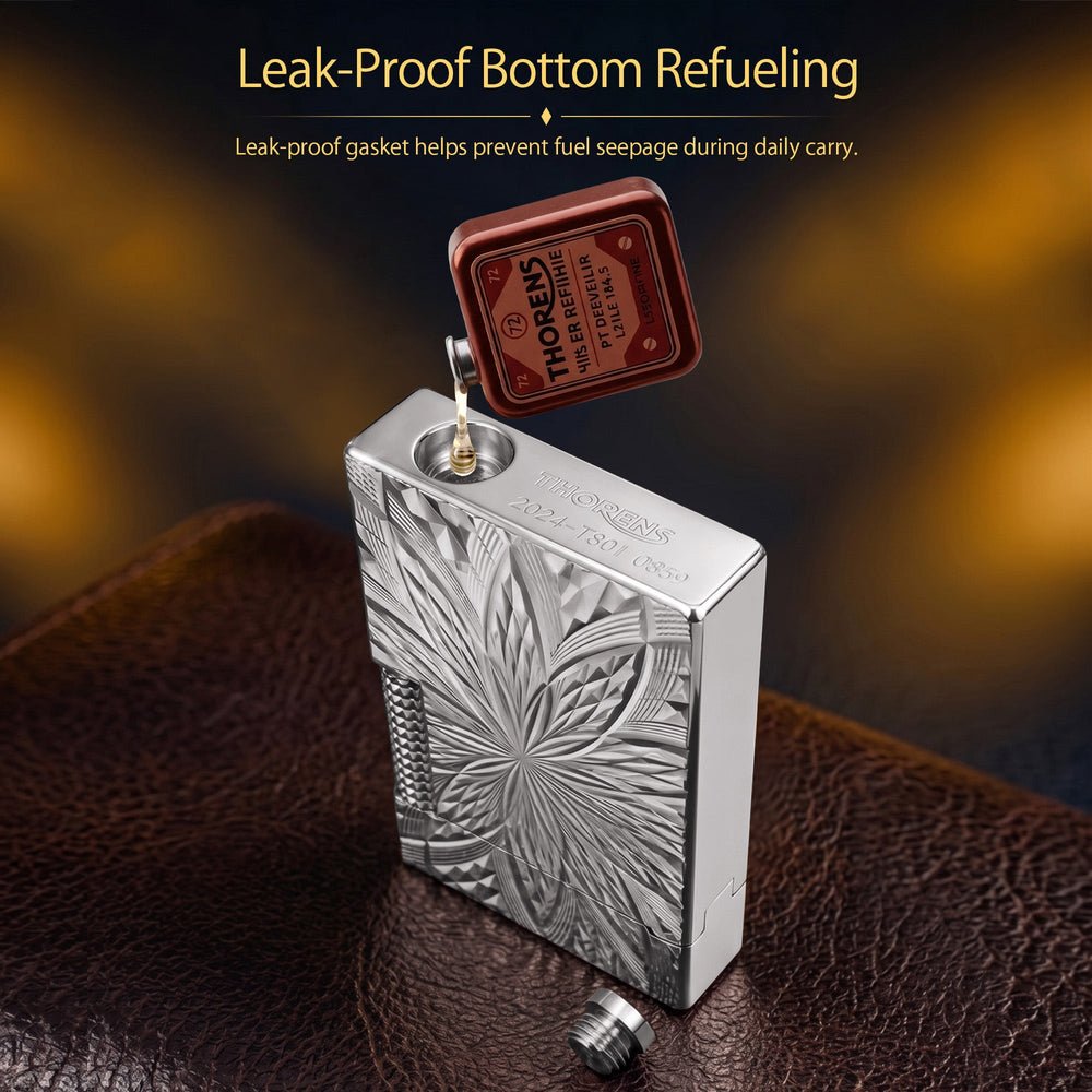 A close-up view of the Thorens Blooming Radiance silver lighter lying on its side, highlighting the polished finish, deep geometric engravings, and the branded bottom plate with its serial number.