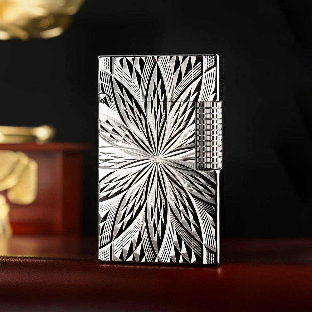 A front-facing view of the Thorens Blooming Radiance silver lighter, showcasing its high-polished silver plating and the intricate, light-catching floral engraving.