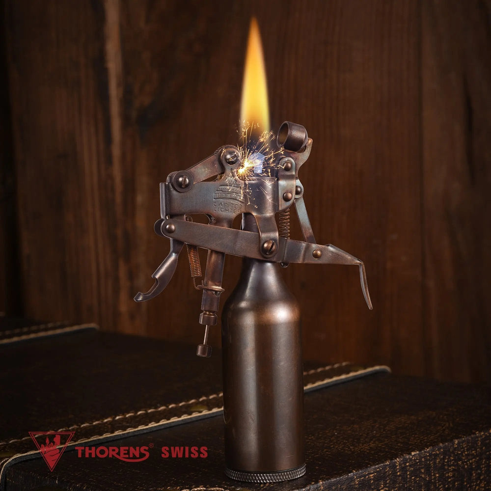 An ignited Capitol Table Lighter in a glossy bronze finish, featuring a steady flame and visible mechanical sparks against a rustic wooden background.
