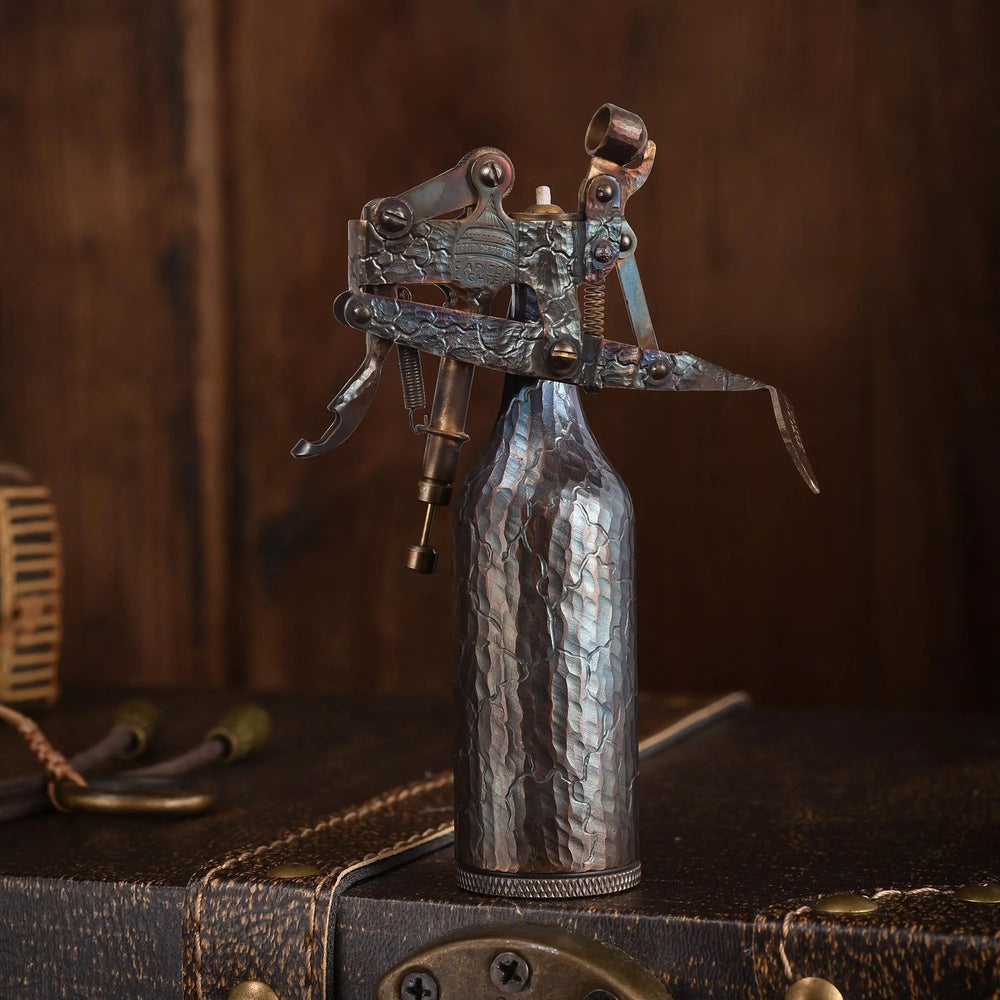A Capitol Table Lighter featuring a textured, hand-carved crackle finish and an iridescent antique patina, standing upright on a vintage leather trunk.
