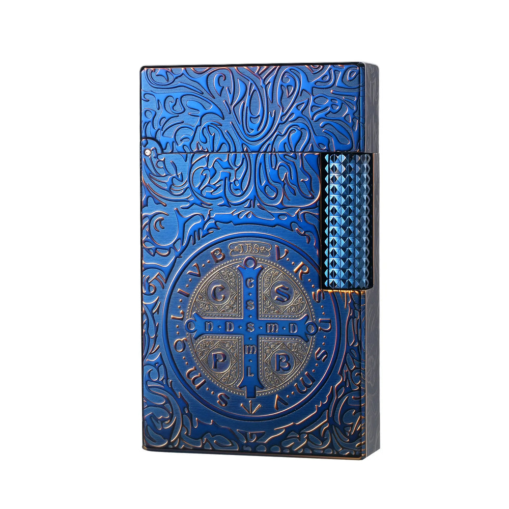 A closed Constantine Midnight Blue Sigil lighter featuring deep blue brass craftsmanship with an embossed St. Benedict medal and scrolling filigree.