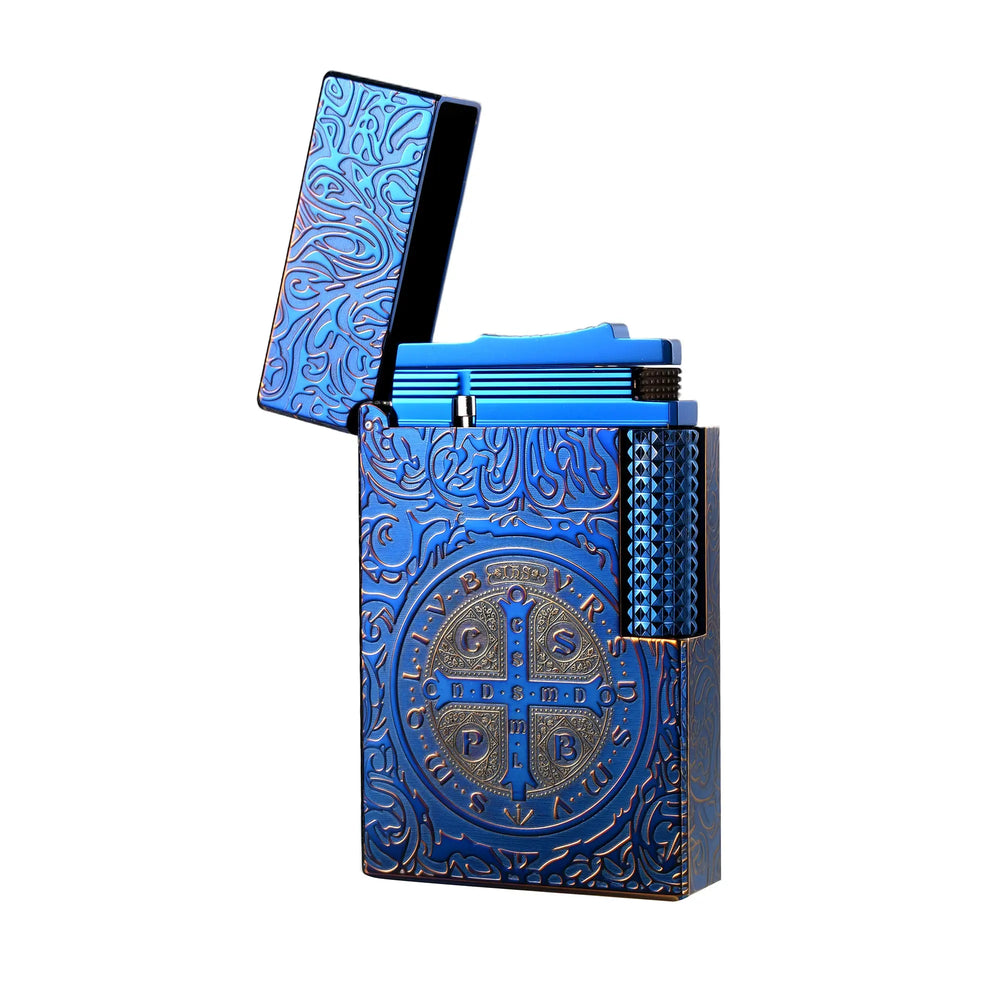 An open Constantine Midnight Blue Sigil lighter showcasing the intricate St. Benedict medal engraving and deep blue brass finish.