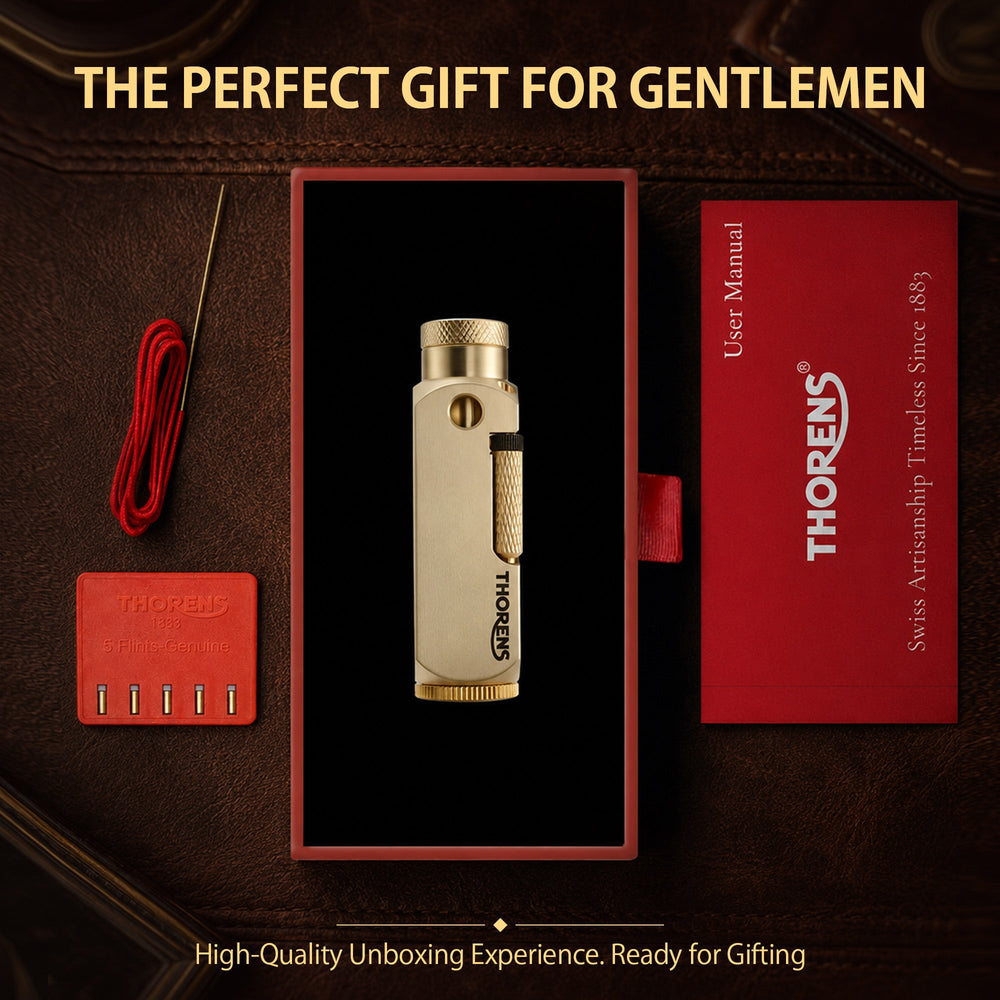 A brushed brass Flamido lighter with a unique octagonal body, featuring the Thorens logo and a knurled plunger, resting on a black and white chessboard.