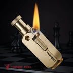 An ignited Flamido brass lighter showing a tall steady flame and ignition sparks, emphasizing its unique top-plunger mechanical design on a dark chessboard background.