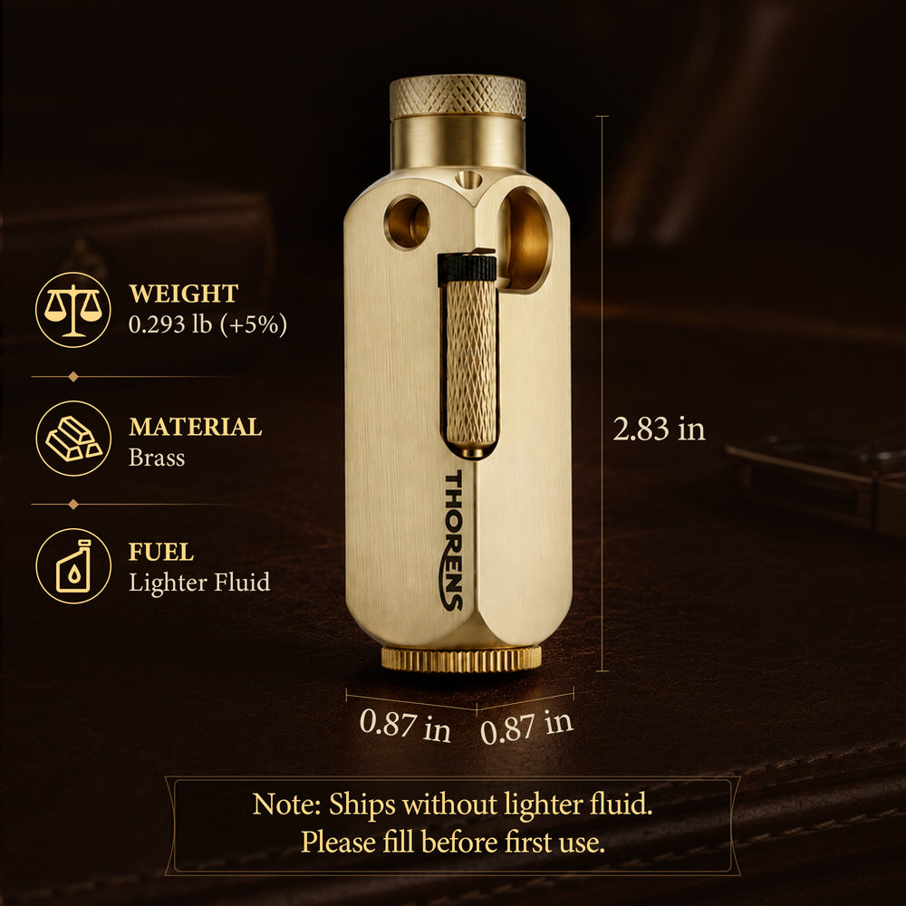 A vertical view of the Flamido brass lighter, highlighting its brushed finish, octagonal body, and the extended plunger mechanism, standing on a dark chessboard.