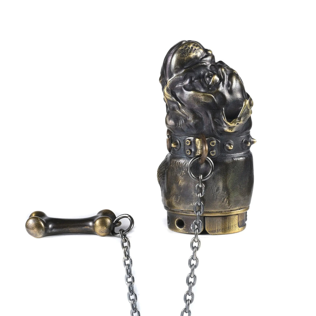 A 3D sculpted French Bulldog lighter in antique brass, featuring a spiked collar connected to a metal chain and a brass bone accessory.