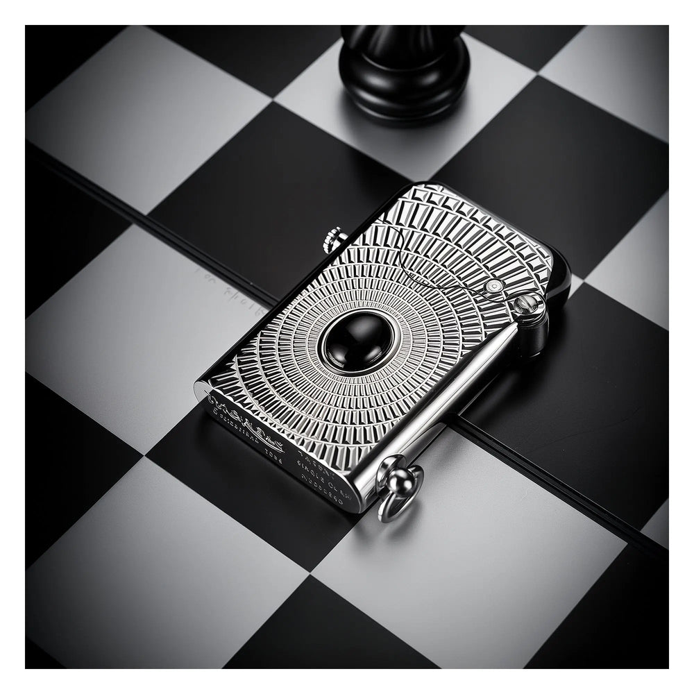A vertical profile of the silver Thorens Gen 1 lighter featuring the "Eye of Diamond" pattern; close-up highlights the precision radial engraving and the central black stone inlay.