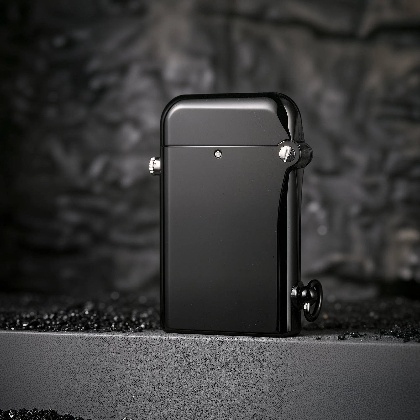 A closed Gen 2 Double Claw lighter with a deep glossy black finish, featuring a refined mechanical hinge and a lanyard ring at the base for a tactical yet elegant look.